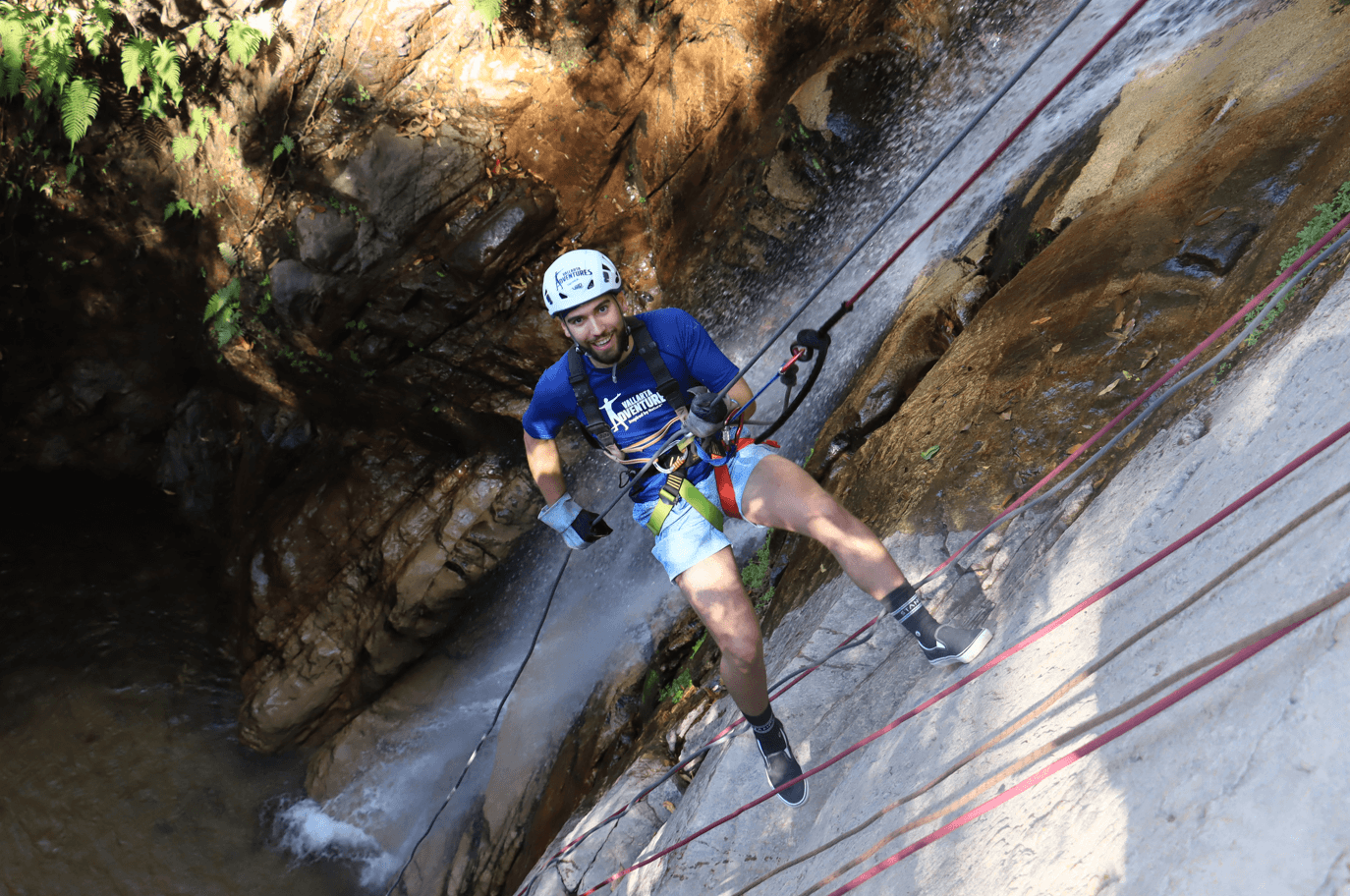 Waterfall rappelling adventure